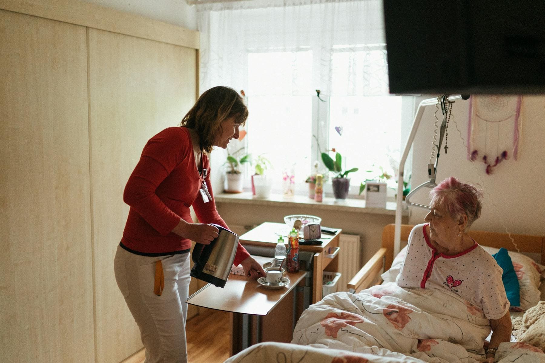 Home health aide assisting with daily care